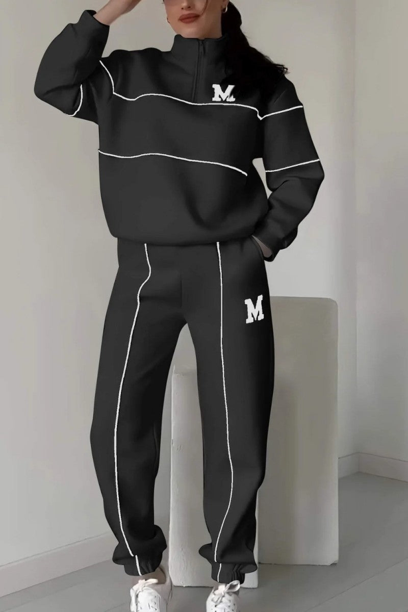 Black sportswear set with embroidered M – sweatshirt and loose pants for hijabi women in Europe – available at CATRIXA Belgium.