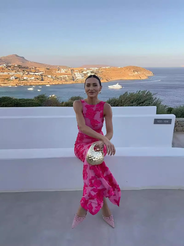 Discover CATRIXA’s sleeveless maxi dress with fuchsia floral embroidery – a modest, royal-inspired design for weddings and events in Europe. Fast EU shipping & sizes!