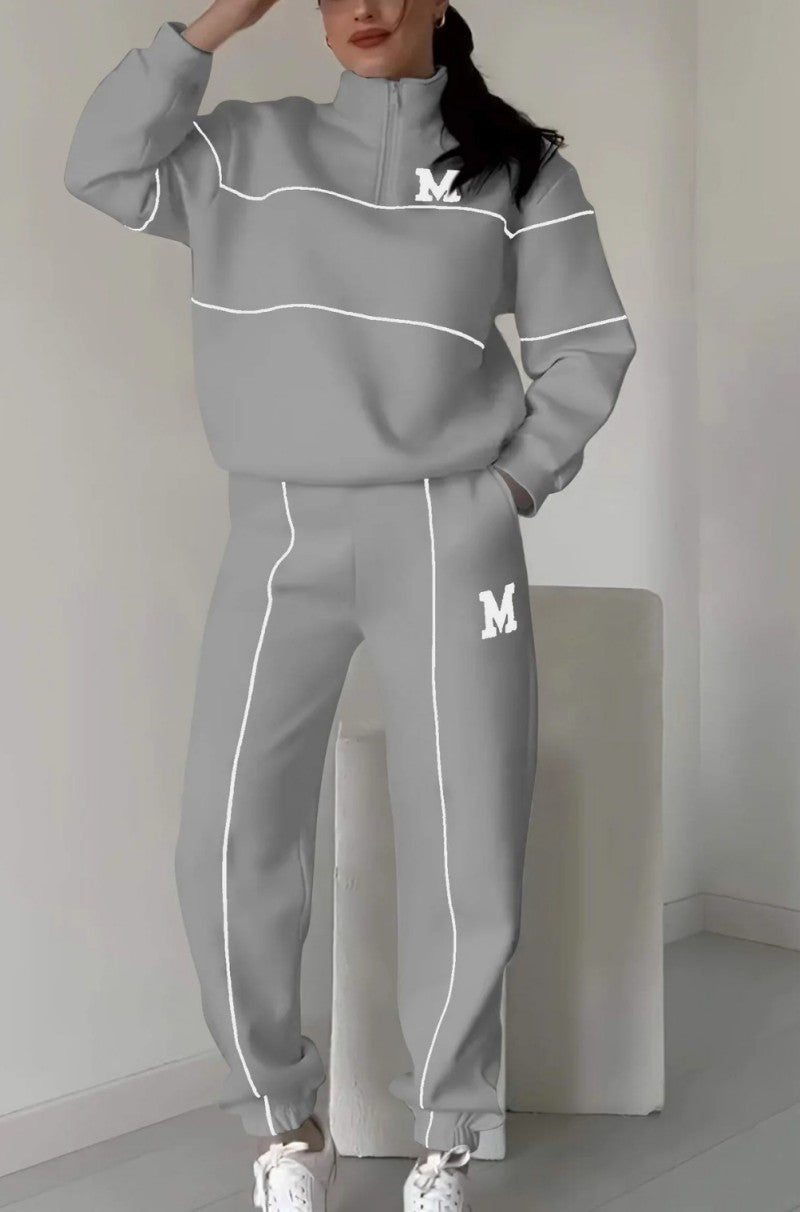 Black sportswear set with embroidered M – sweatshirt and loose pants for hijabi women in Europe – available at CATRIXA Belgium.