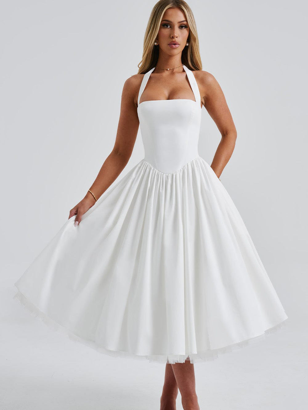 White midi dress with neck tie and pleated skirt – modest classic design for European occasions – available at CATRIXA Belgium.